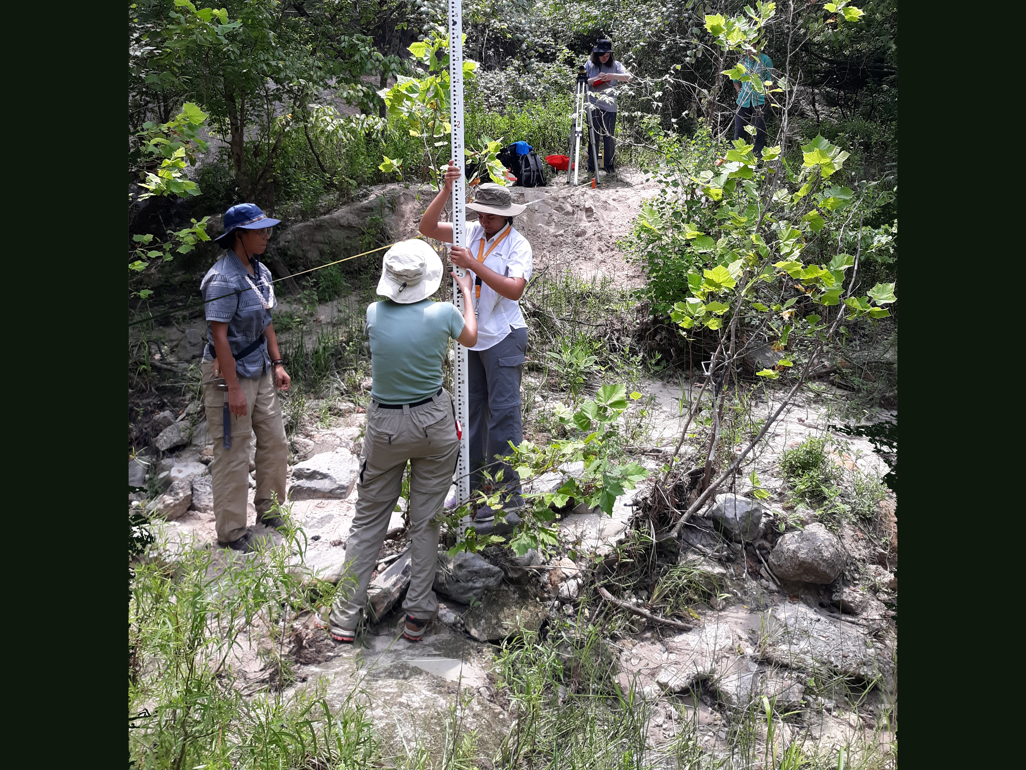 Students measuring a stream profile